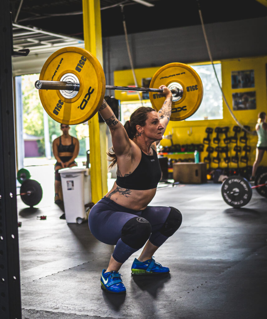 Women in strength training session at CrossFit100.